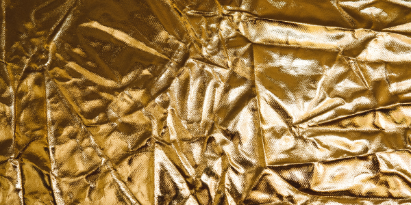 The Art of Foiling Fabrics in Fashion
